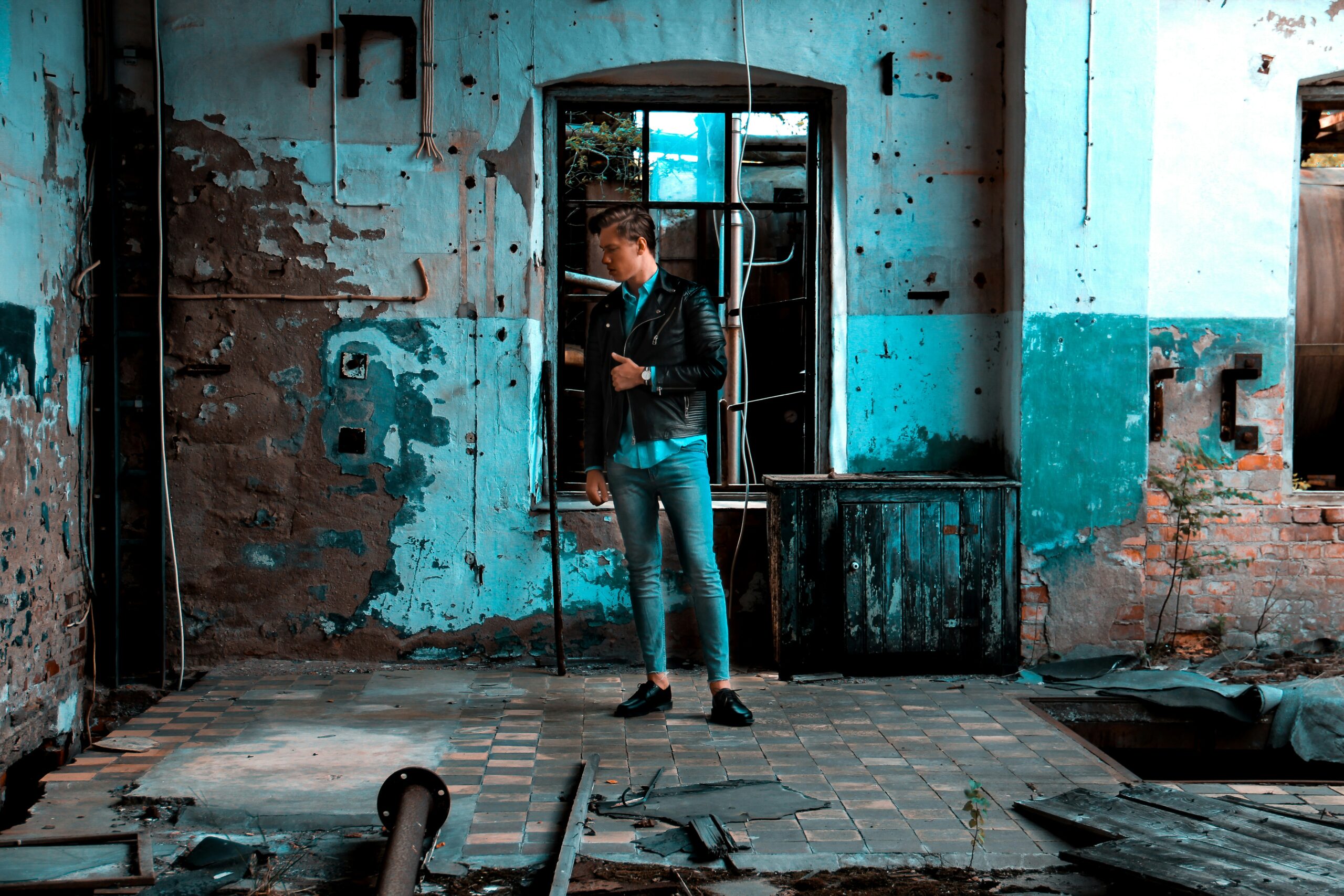 man standing near window